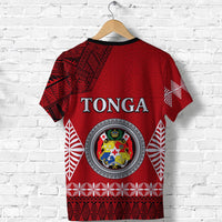 Red Tonga graphic T-shirt with crest and abstract sleeve patterns
