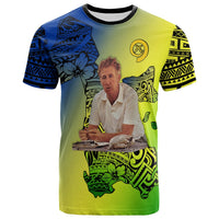 Yellow T-shirt with blue patterned island graphic; front print with person