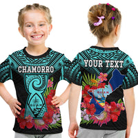 Kids graphic T-shirt, black with turquoise tribal pattern, flowers and Guam emblem