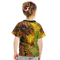 Kids graphic t-shirt, back view, brown green yellow with tiki artwork and fern pattern