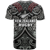 Black rugby T-shirt with Maori-style pattern, red lines, and New Zealand Rugby text.
