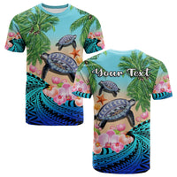 Blue tropical turtle T-shirt with palm leaves, orchids, starfish, and shell graphics