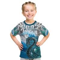 Blue graphic kids T-shirt with ocean waves, fish, and Maori-style pattern