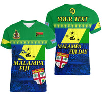 Green V-neck t-shirt with blue-yellow floral graphic, flags, and large front text
