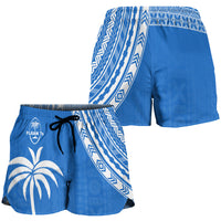 Women's blue rugby shorts, side view with white geometric print and elastic waist drawstring