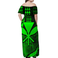 Back view: green and black off-shoulder maxi dress with tropical geometric print