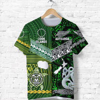Green T-shirt front with Cook Islands text, Aotearoa banner, tribal motifs and octopus figure