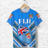 Blue Fiji day T-shirt with FIJI text and heart emblem, patterned sleeves
