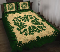 Green and cream bed quilt with large leafy medallion center and two green square pillows