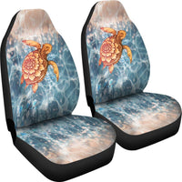 Universal car seat cover pair with turtle design on blue waves; black borders and headrests