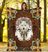 white-wolf-with-headress-feathers-blanket