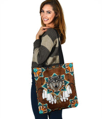 Brown tote bag with wolf medallion print, turquoise geometric corners, black shoulder strap