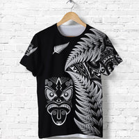 Black T-shirt with silver fern leaves and Maori mask graphic on front