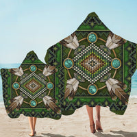 Green beach blanket towel with large mandala bead-and-feather graphic, border print