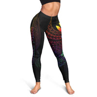 Black leggings with vibrant tribal band pattern and butterfly accent on front