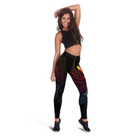 Black leggings with colorful Polynesian print and butterfly, worn with cropped top