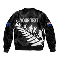 Black bomber jacket back with 'YOUR TEXT' print, player silhouettes, NZ flag sleeve patch