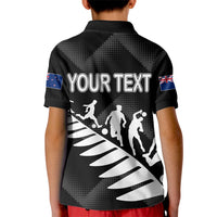 Black kid polo shirt with collar, back graphic and 'YOUR TEXT' plus NZ flag sleeve