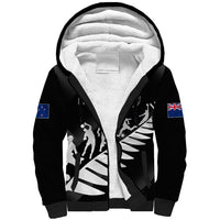 Black sherpa hoodie with zip front, hood lining, sports graphic and flag sleeve patches