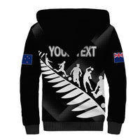 Black sherpa hoodie with hood, back sports graphic and flag sleeve patches