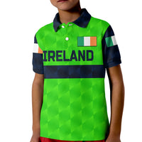 Green kid cricket polo shirt with navy collar, buttons, and Ireland front graphic