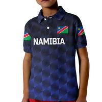 Kid navy cricket polo with check pattern, Namibia text, flag patch, button collar