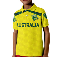 Kids yellow cricket polo shirt with green collar, Australia logo and printed name
