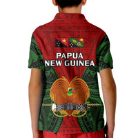 Kids red polo shirt with green sleeves, Papua New Guinea back graphic and bird emblem