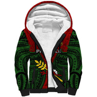 Red and green sherpa hoodie with black zipper, white-lined hood, front graphic panel.