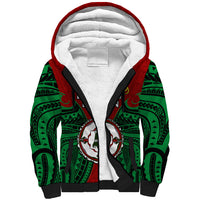Unisex red sherpa hoodie with green Polynesian pattern, black trim, front graphic