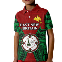 Kids red polo shirt with green patterned sleeves and East New Britain emblem