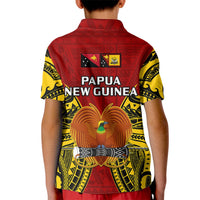 Kids red polo shirt with yellow patterned sleeves, Papua New Guinea crest and bird