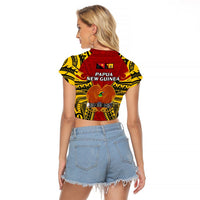 Red cropped raglan T-shirt with Papua New Guinea crest and yellow tribal pattern (back)