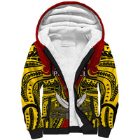 Red sherpa hoodie with white hood lining and black/yellow Polynesian-style sleeve print