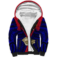 Red and blue patterned sherpa hoodie with white lined hood and black zipper
