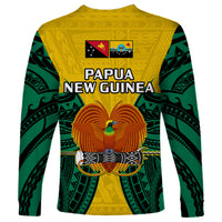 Long-sleeve shirt in yellow with green sleeves and Papua New Guinea bird crest art
