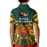 Kids green polo shirt with Papua New Guinea text, emblems, and bird graphic on back