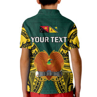 Kids green polo shirt with yellow tribal sleeves, back print 'YOUR TEXT' and bird emblem