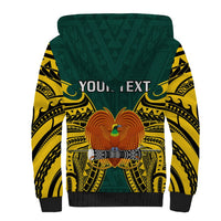 Green sherpa hoodie with yellow tribal print and eagle emblem, 'YOUR TEXT' on back