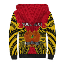 Sherpa hoodie back with red and yellow tribal print, bird emblem, black sleeves
