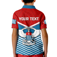 Kids polo shirt, back graphic with wings, crest and West Papua ribbon, blue stripes