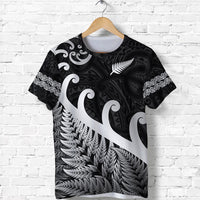 Black T-shirt with silver fern and koru swirls graphic on front