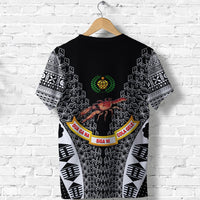 Black short-sleeve rugby T-shirt with green emblem, tapa patterns, and colored banner text