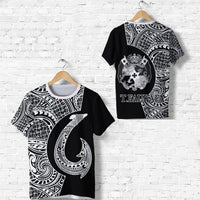 Black T-shirt with large white fish-hook and Polynesian tribal pattern front print