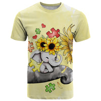 Yellow T-shirt with cartoon elephant, sunflowers, puzzle pieces, and hearts