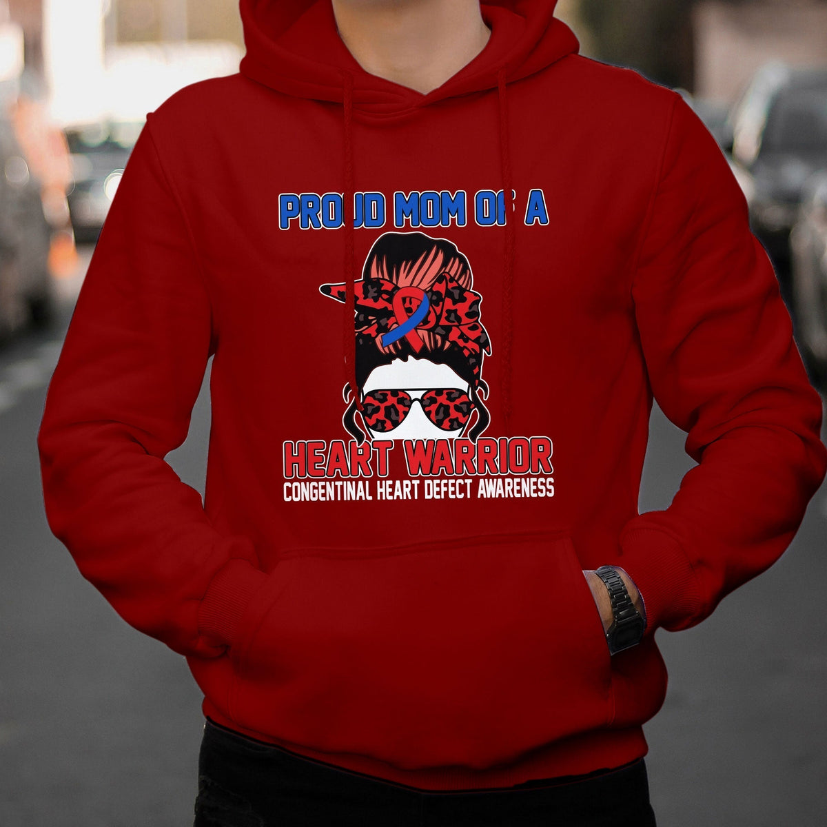 Red hoodie with “Heart Warrior” heart-defect awareness graphic on the chest