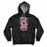 Women’s black hoodie with front kangaroo pocket, drawstring hood, and pink Women’s Day graphic