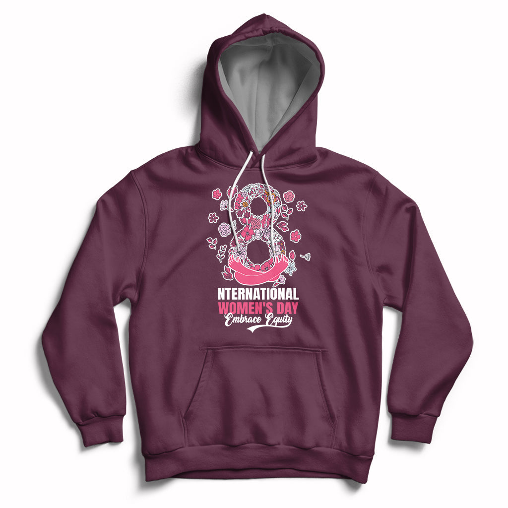Women’s maroon hoodie with front kangaroo pocket, drawstring hood, and pink Women’s Day graphic