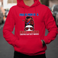 Red hoodie with “Heart Warrior” heart-defect awareness graphic on the chest