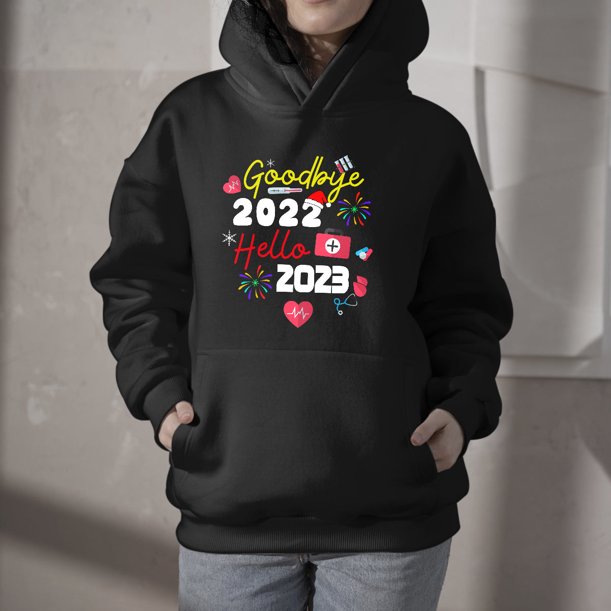 Black nurse hoodie worn by child, chest graphic with 2022 and 2023